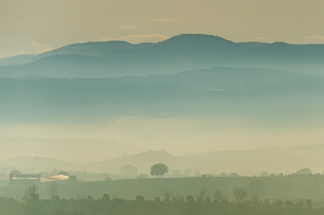 Layers of hills fading into morning mist